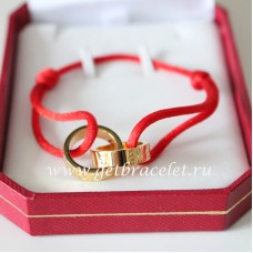 Bransoletka Cartier Double Ring Love z żółtego złota z czerwoną liną